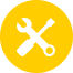 Icon wrench and screw driver in the shape of an x on a yellow circle shape