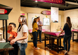 A group of people in a museum gallery