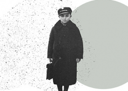 A black and white image of a boy wearing a hat and a long dark coat holding a small suitcase