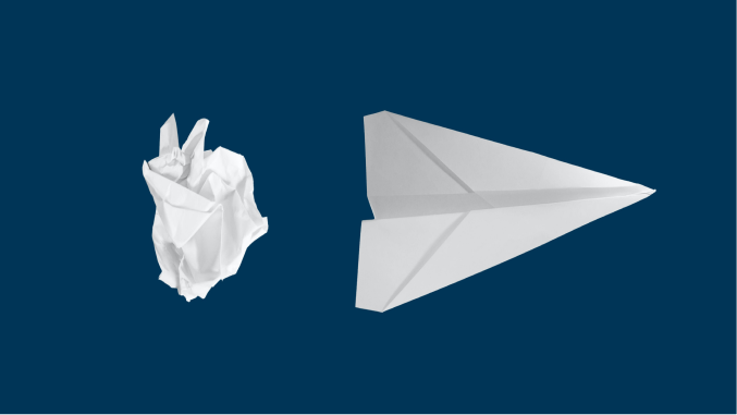 A crumpled up piece of paper and a paper airplane on a blue background